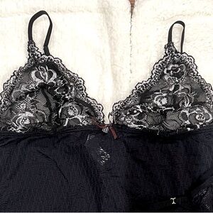 Black with white lace teddy made in Colombia size Large. Runs small.